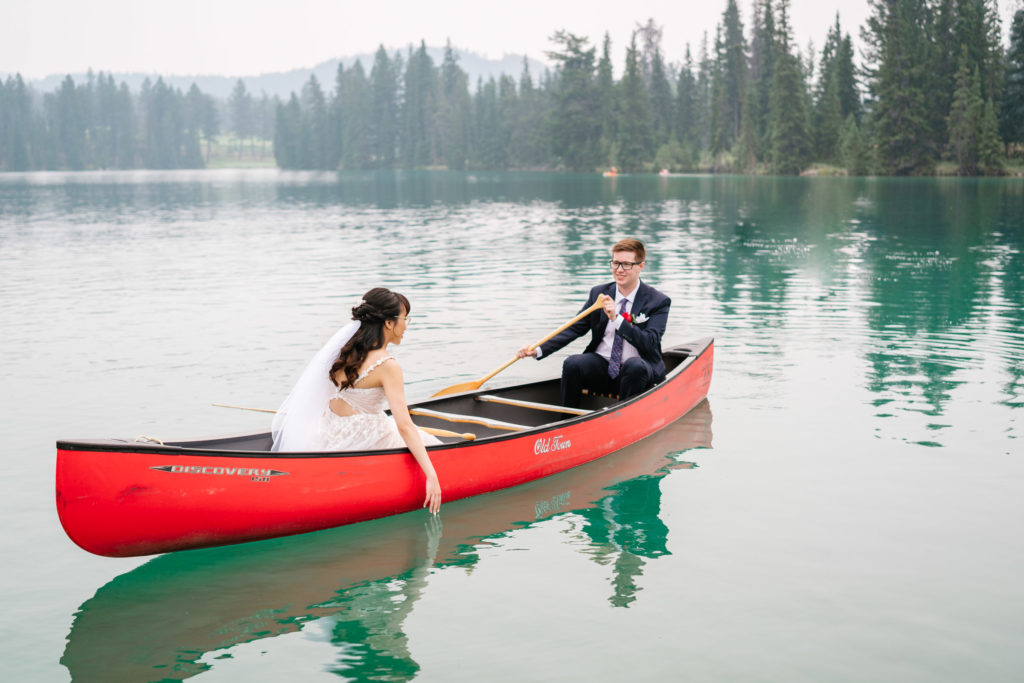 Bride and groom in canoe at the Jasper Park Lodge
