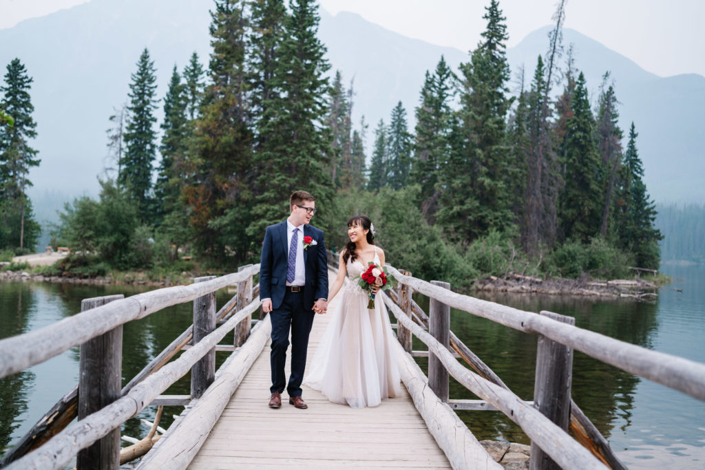 Bride and groom at pyramid island in Jasper National Park