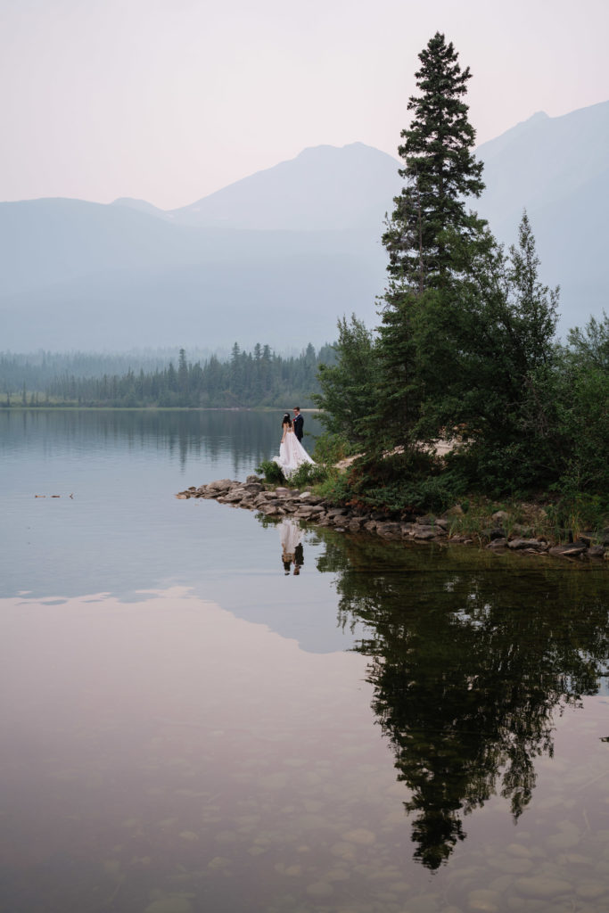Bride and groom and their reflection at Pyramid Lake
