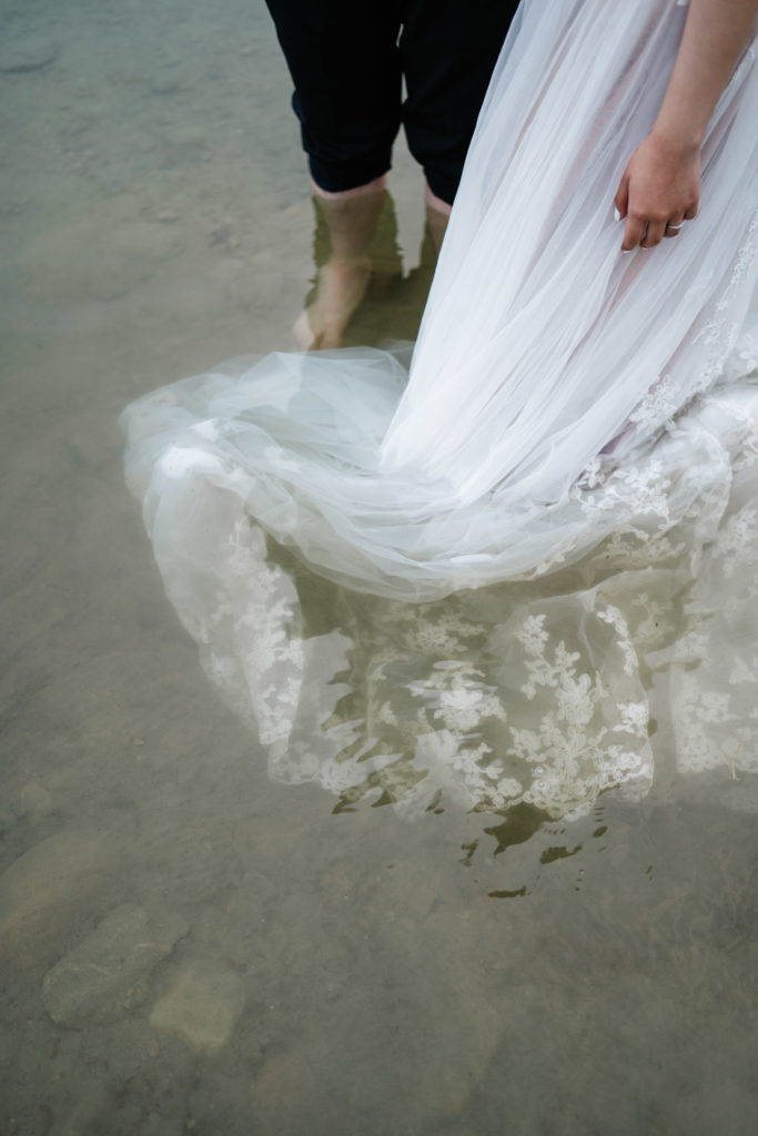 Wedding dress in water in Jasper National Park