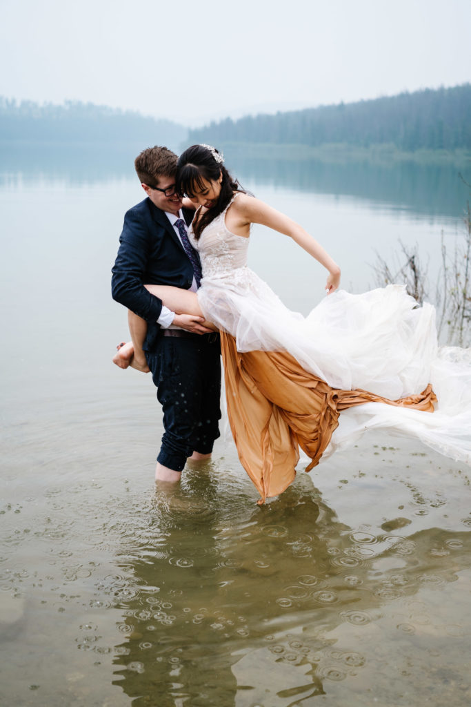 Bride throws train of dress in Patricia Lake