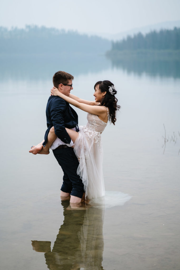 Bride and Groom look at each other in Patricia Lake