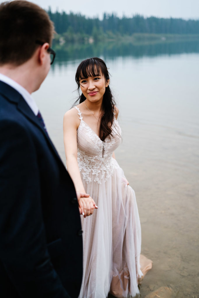 bride looks at groom in Jasper National Park elopement