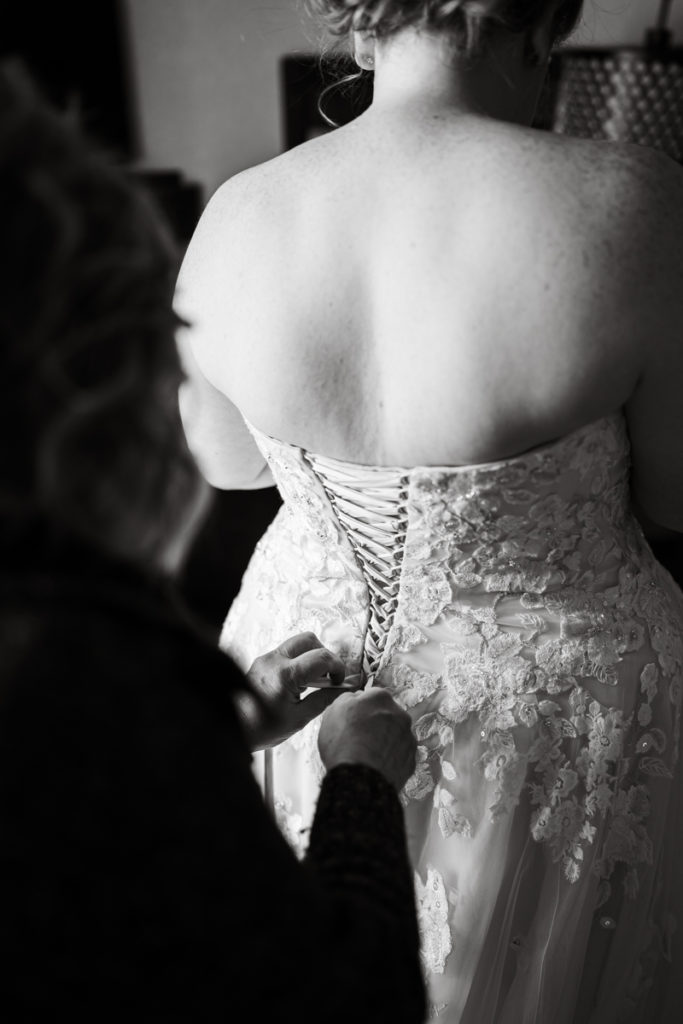 Brides mom does up her corset wedding dress in black and white. 