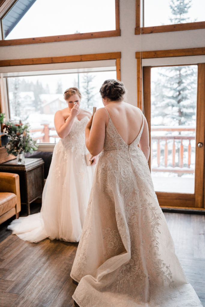 Two brides get emotional during their first look in Canmore Alberta. 