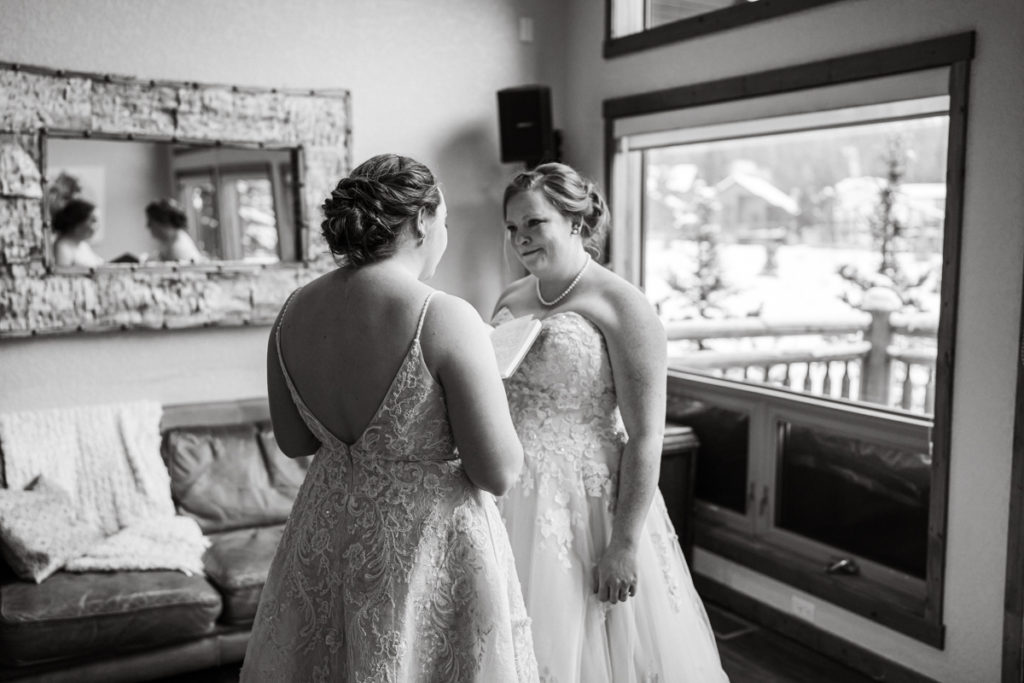 Bride reads vows to wife during private vow exchange. 