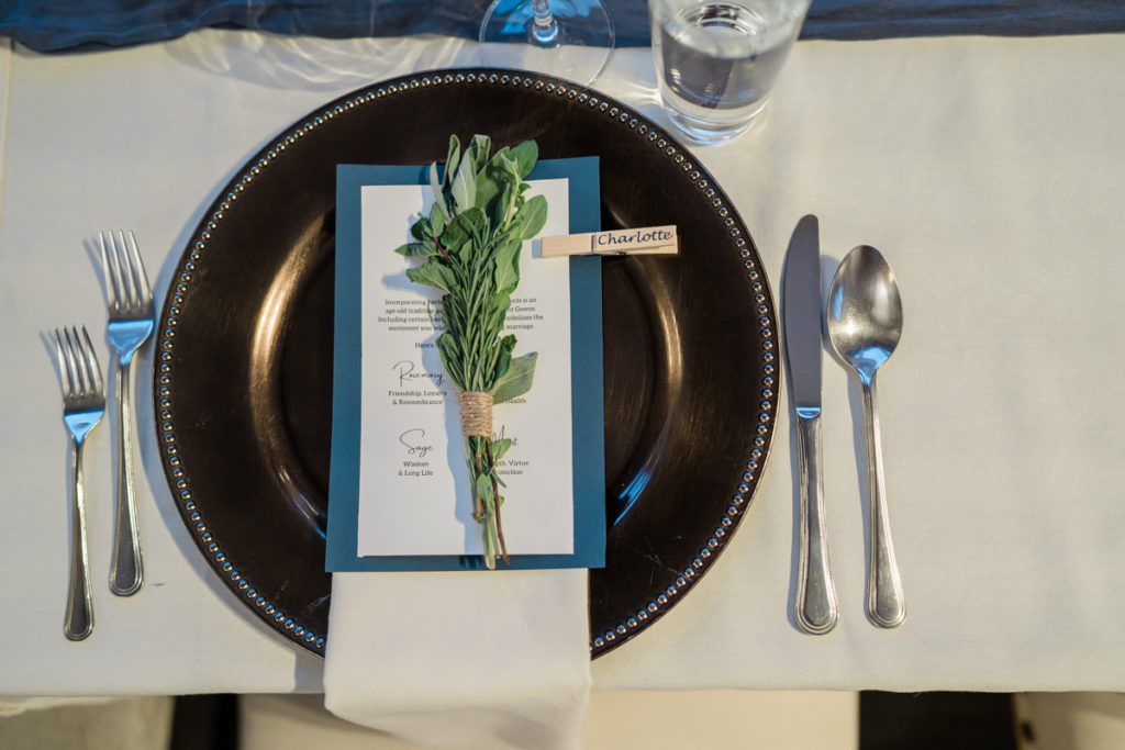 Herbs on a dinner plate during winter wedding. 