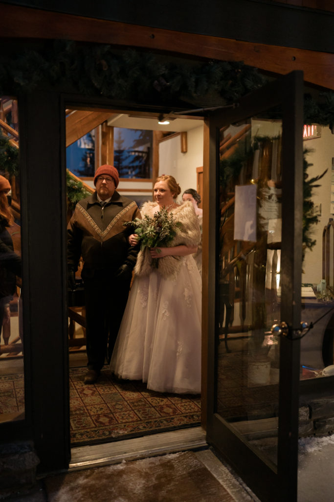 Bride gets ready to walk down the aisle with her father at a Bear and Bison Inn