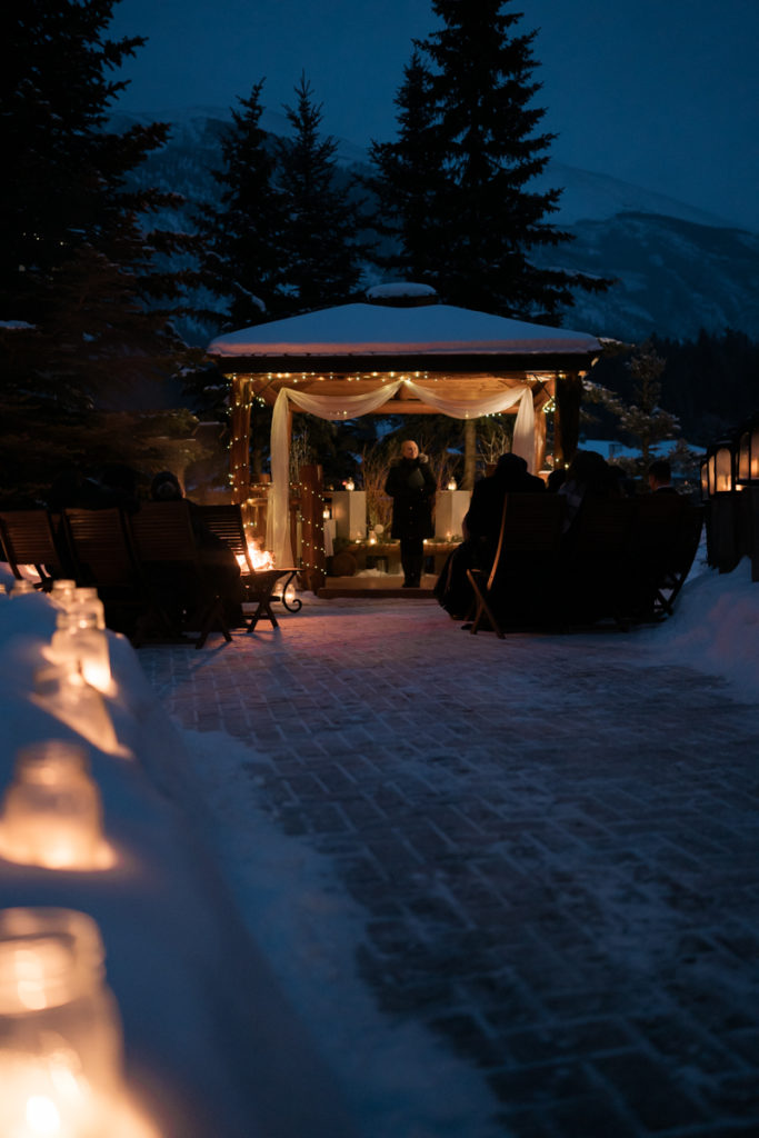 Candle lit outdoor winter ceremony at a Bear and Bison Inn