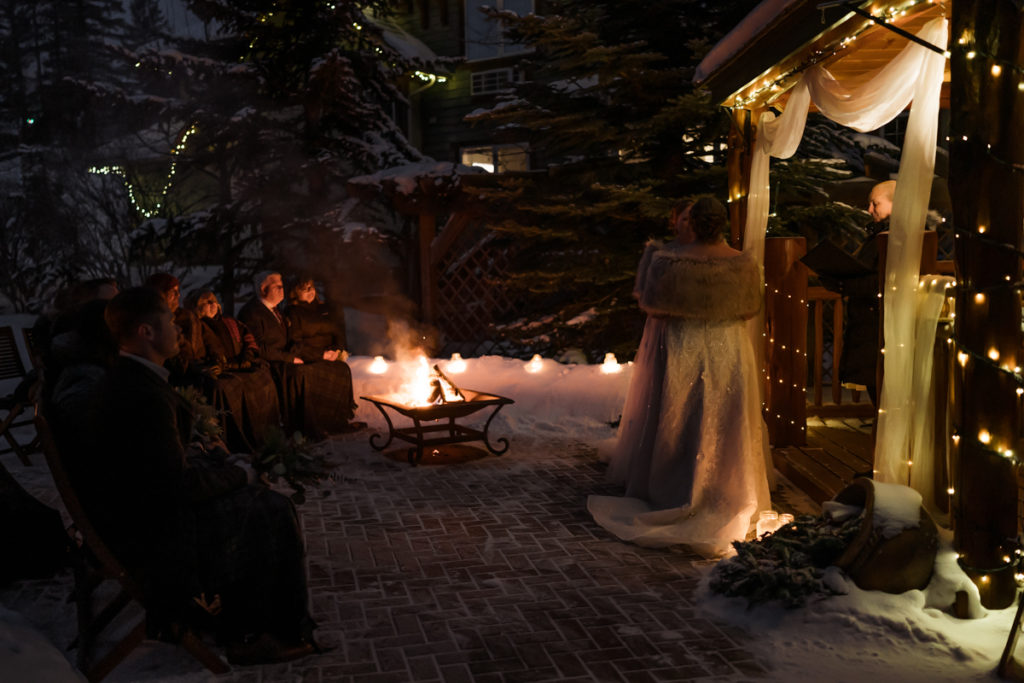 Sunset outdoor winter ceremony with two brides