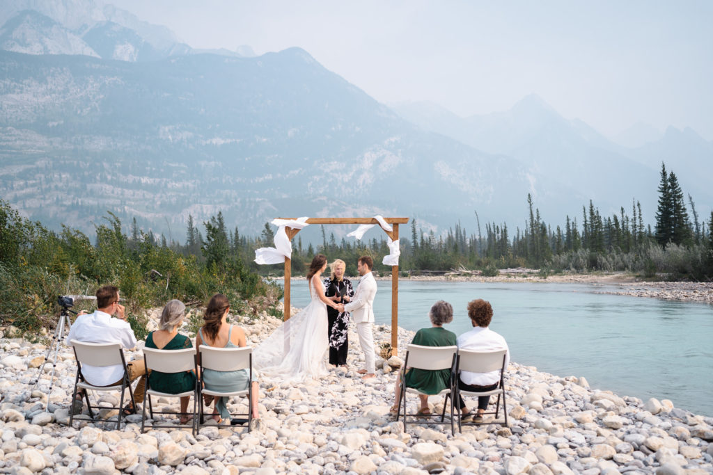 Jasper Intimate Wedding Photographer captures small ceremony by the Snaring river in Jasper National Park. 