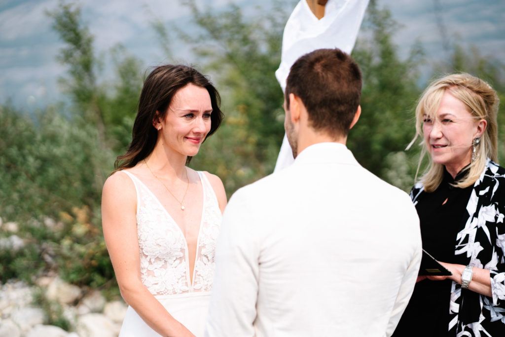 bride looks at groom during intimate jasper wedding. 