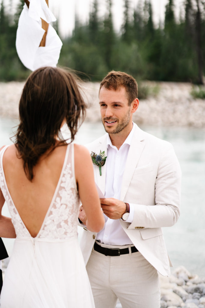 groom reads his personalized vows to bride during Jasper intimate wedding. 