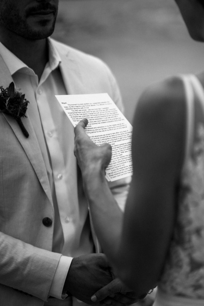 black and white photo of brides personalized vows during Jasper intimate wedding ceremony. 