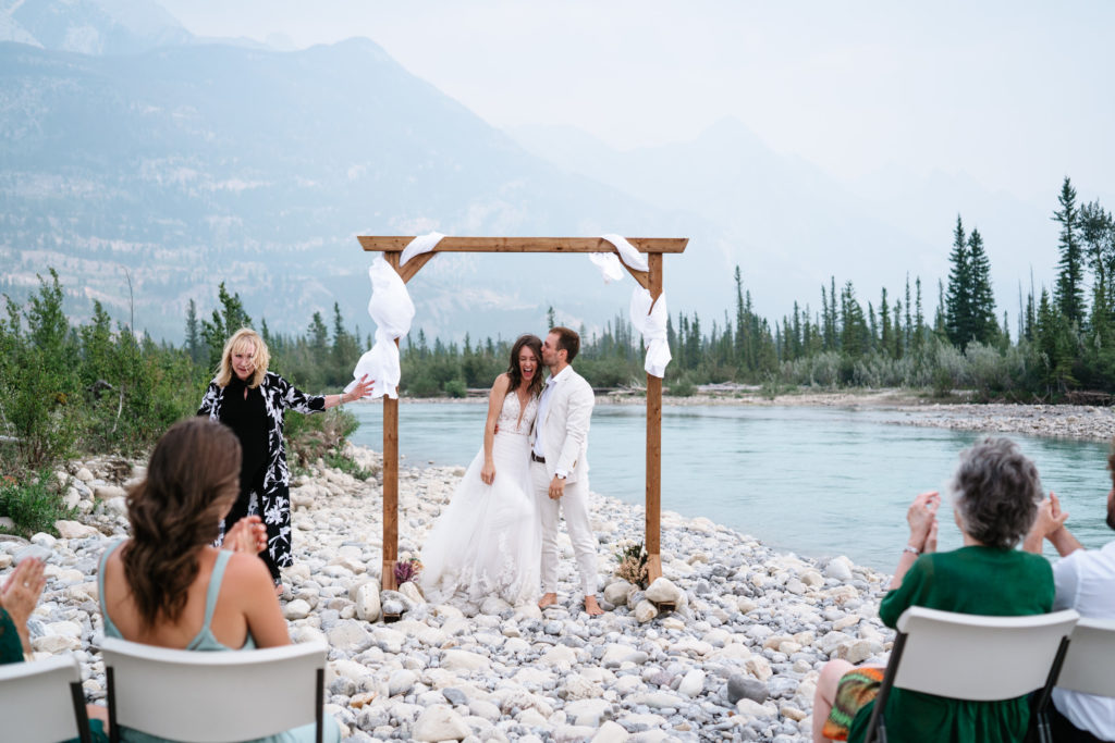 Everyone celebrates after Jasper intimate wedding ceremony by the Snaring River. 