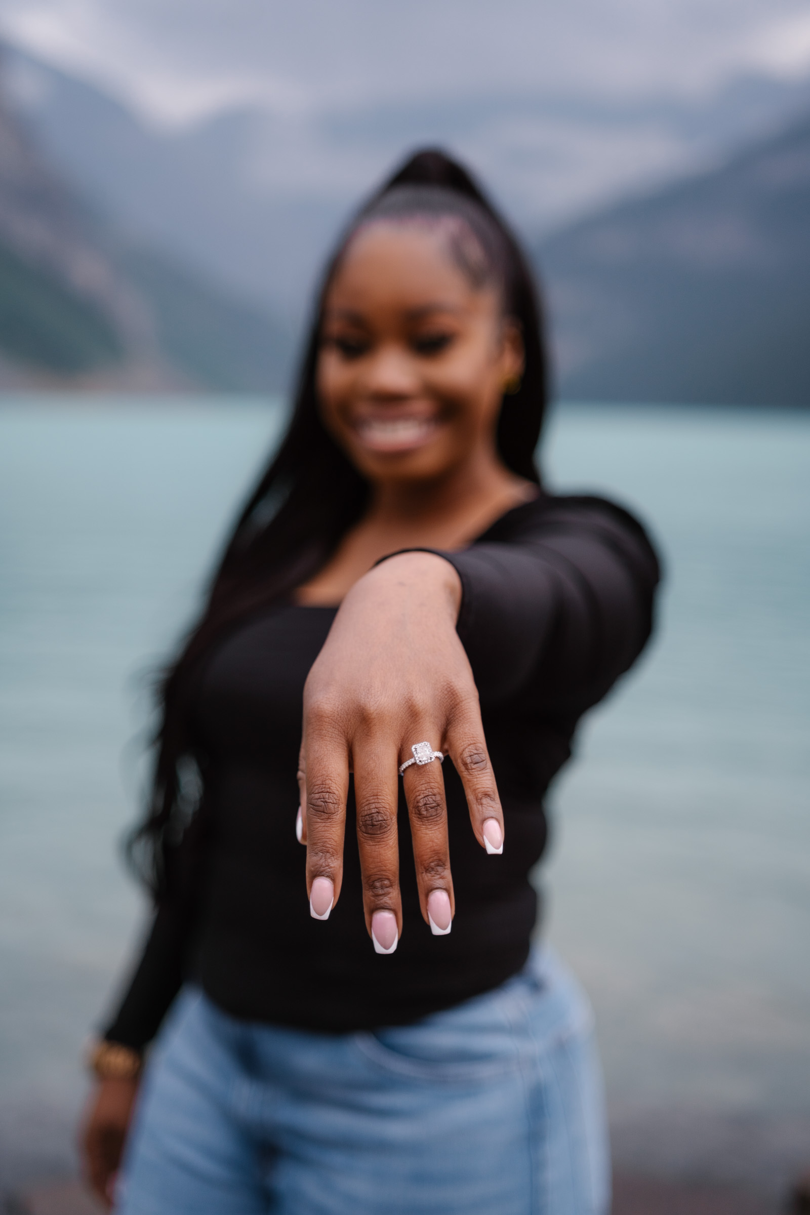 Close up of ring on womans hand after proposal in Banff National Park