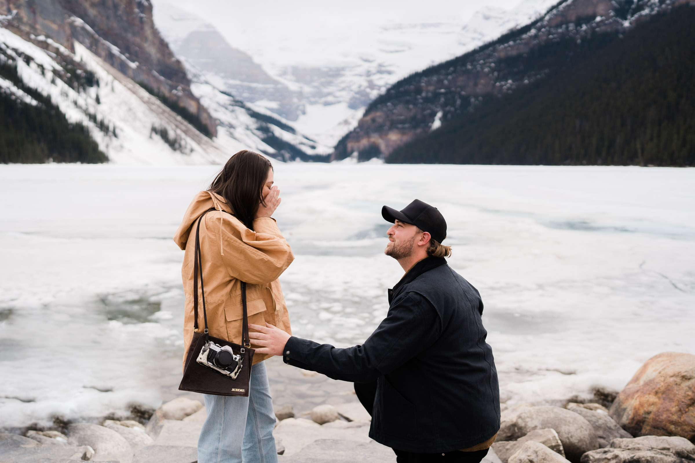 Man proposed to girlfriend in front of a snowy Lake Louise in May. 