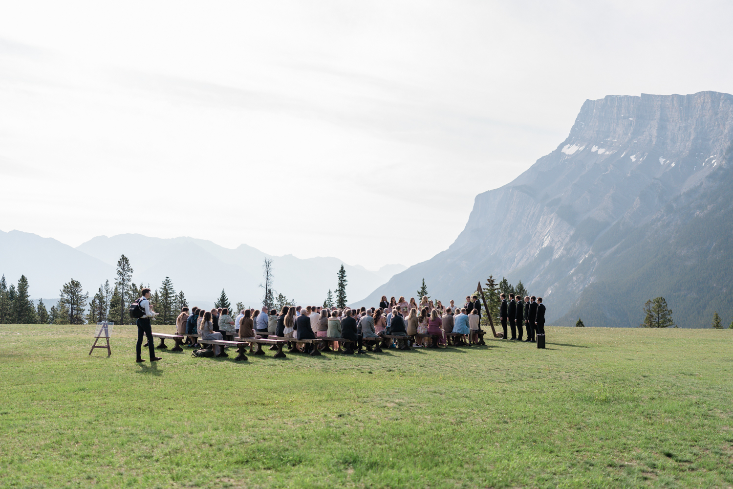 side shot of the whole wedding ceremony at Tunnel Mountain in Banff  in June