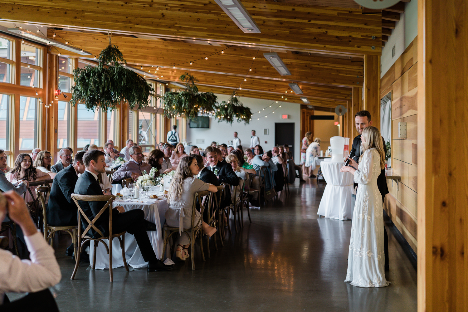 bride and groom stand together and give a speech at Fenlands in Banff 