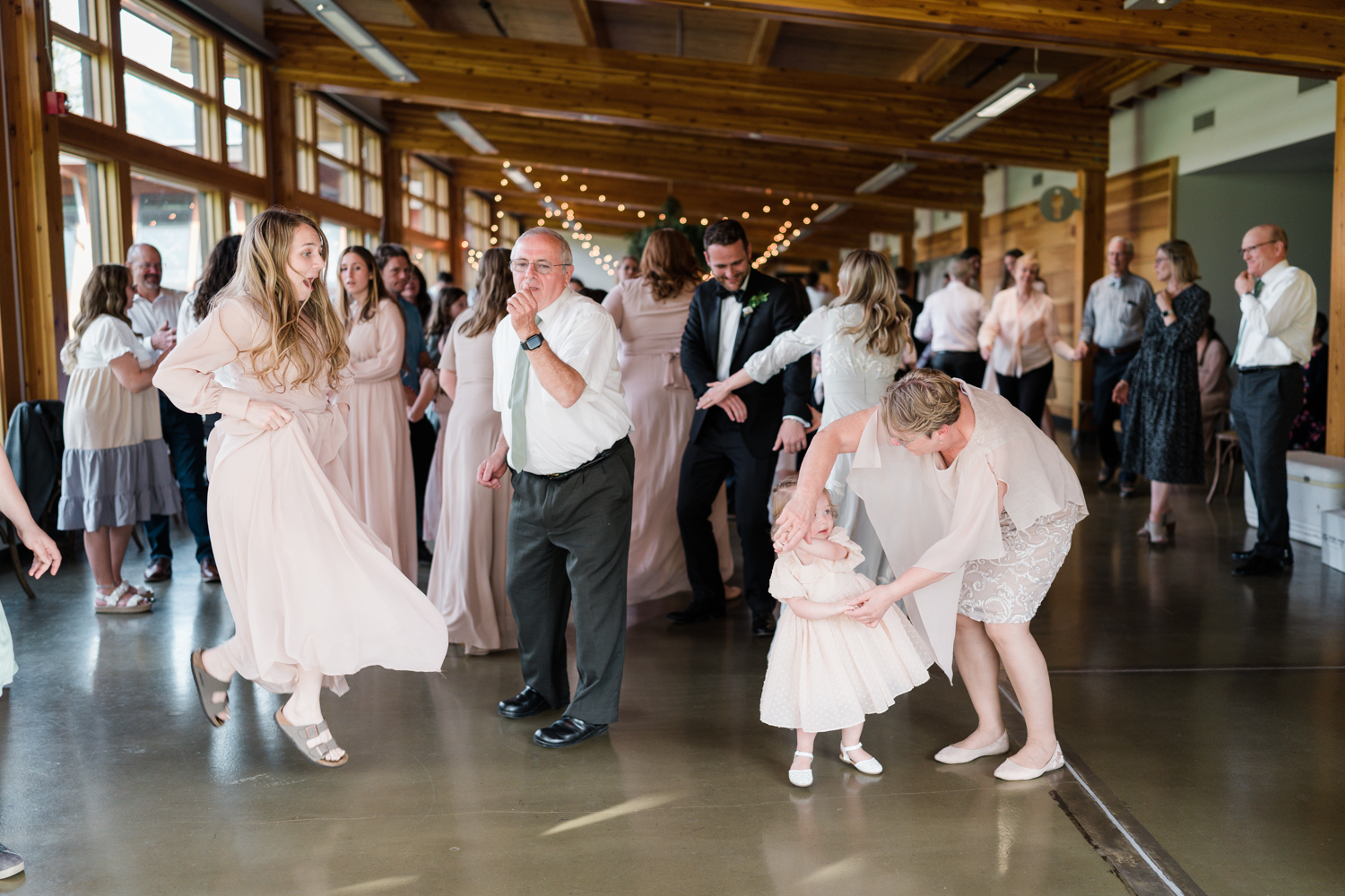 family dances together during wedding reception at Fenlands in Banff 
