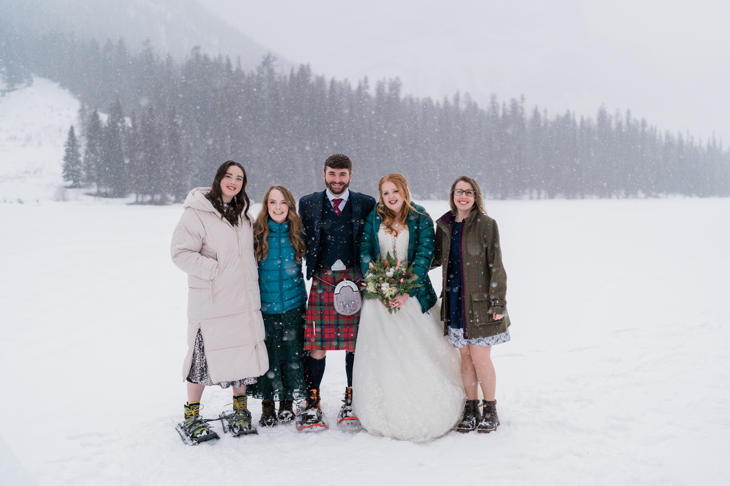 Group of five people during a snowstorm at Emerald Lake