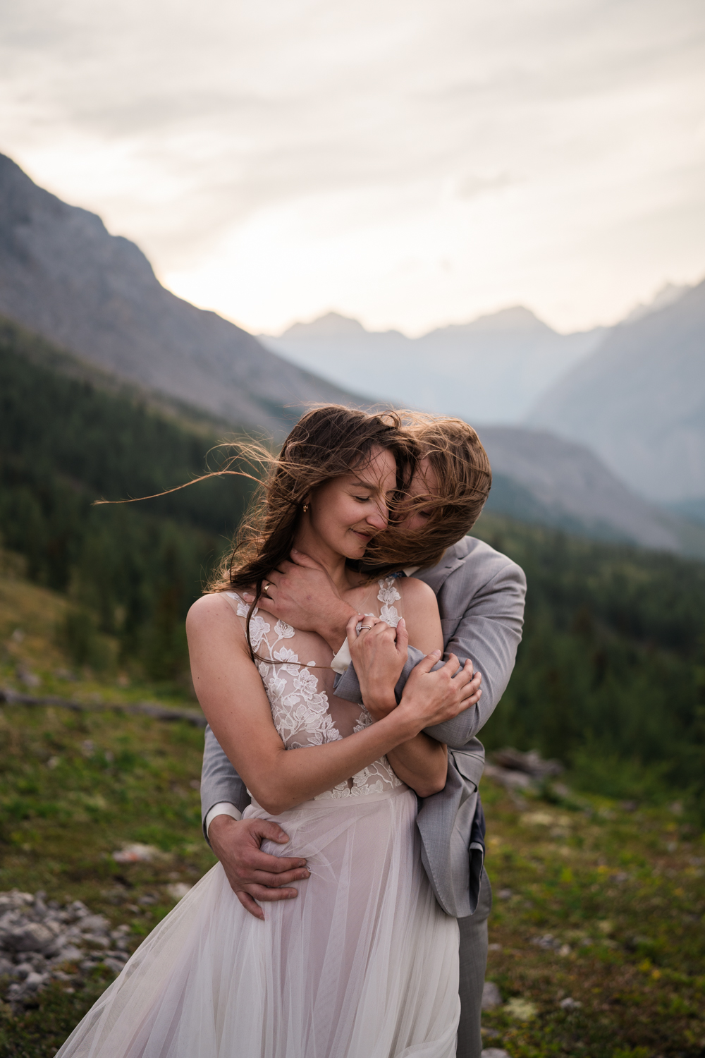 Couples portrait captured against the backdrop of the majestic Alberta mountains during a Kananaskis elopement