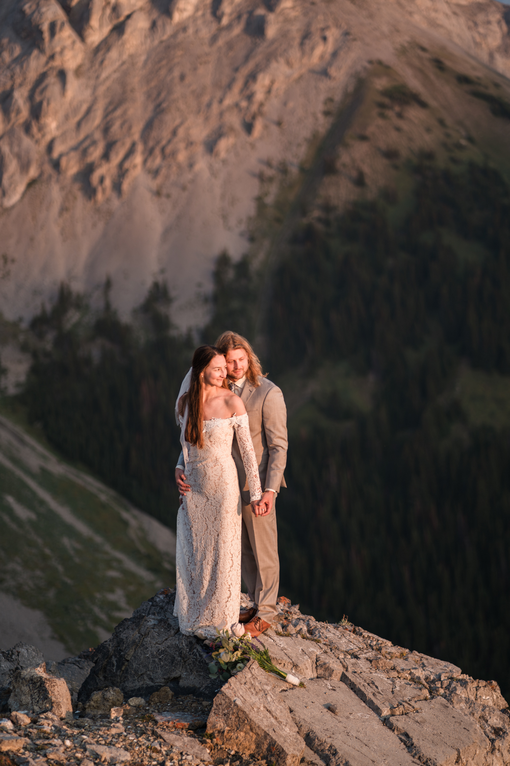 A breathtaking sunrise during an intimate backcountry camping elopement in Alberta's Kananaskis region