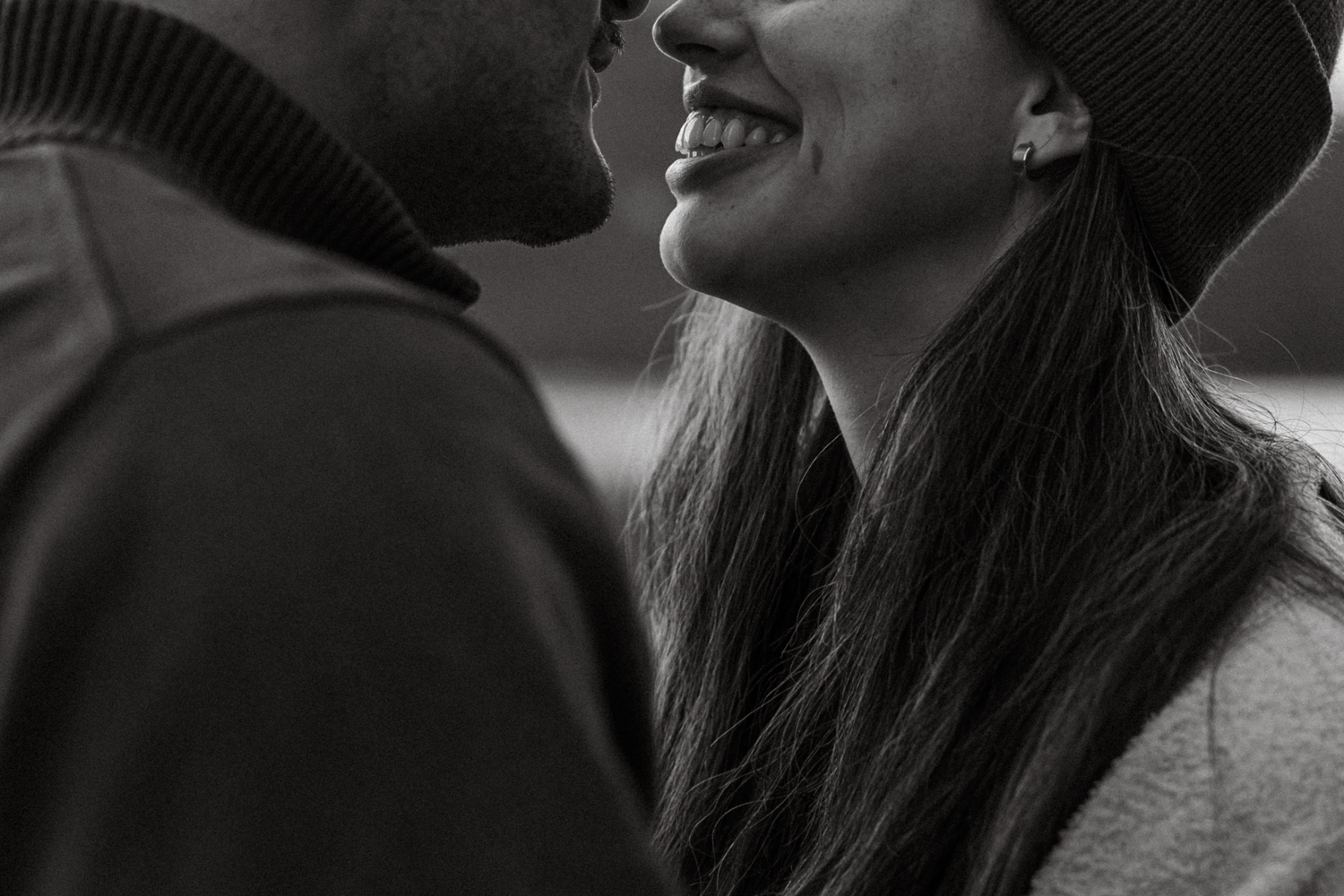 Close up of lower part of couples face smiling at each other for Banff engagament photos. 