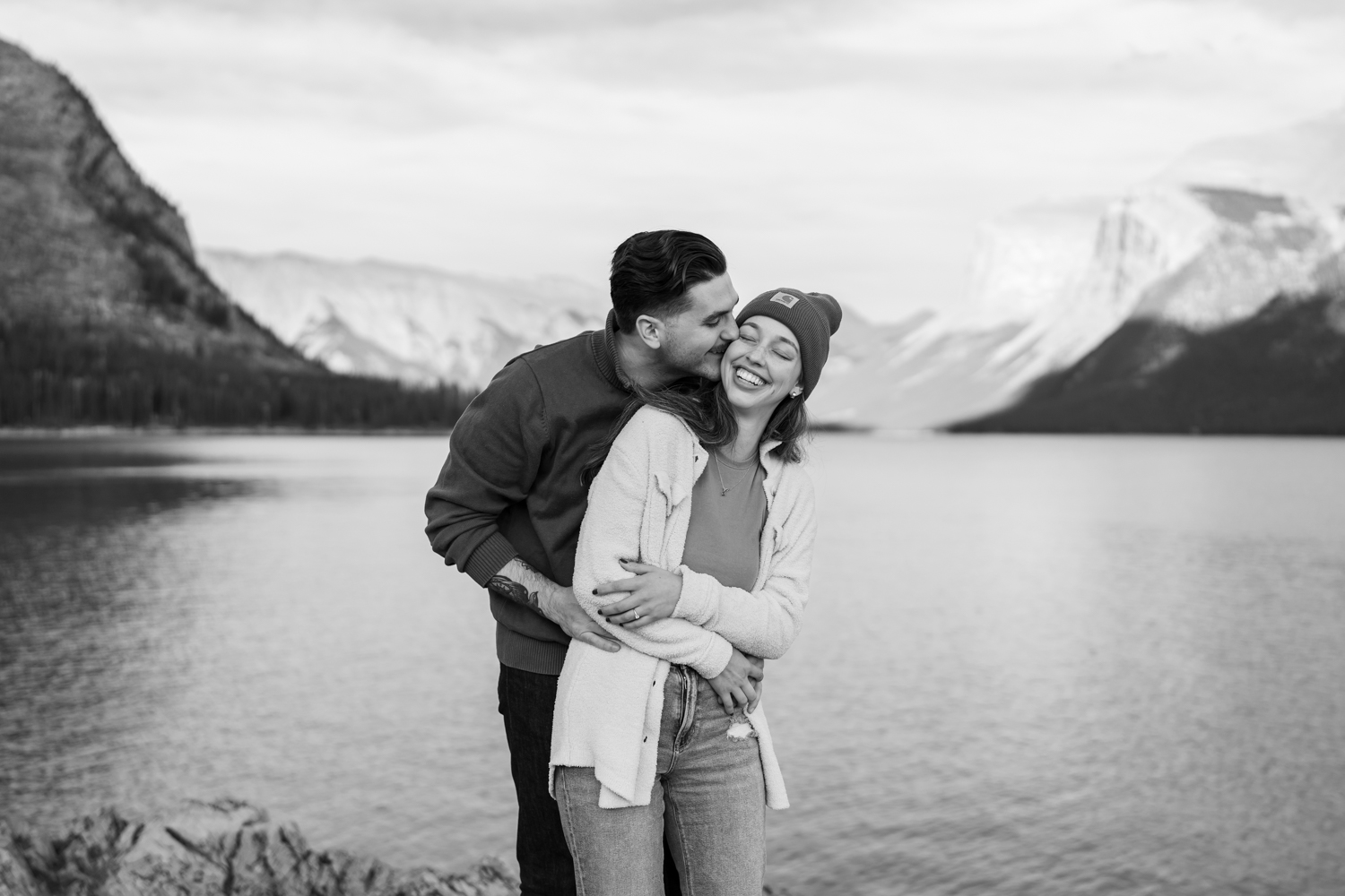 Couple is all smiles after their Banff proposal at Lake Minnewanka. 