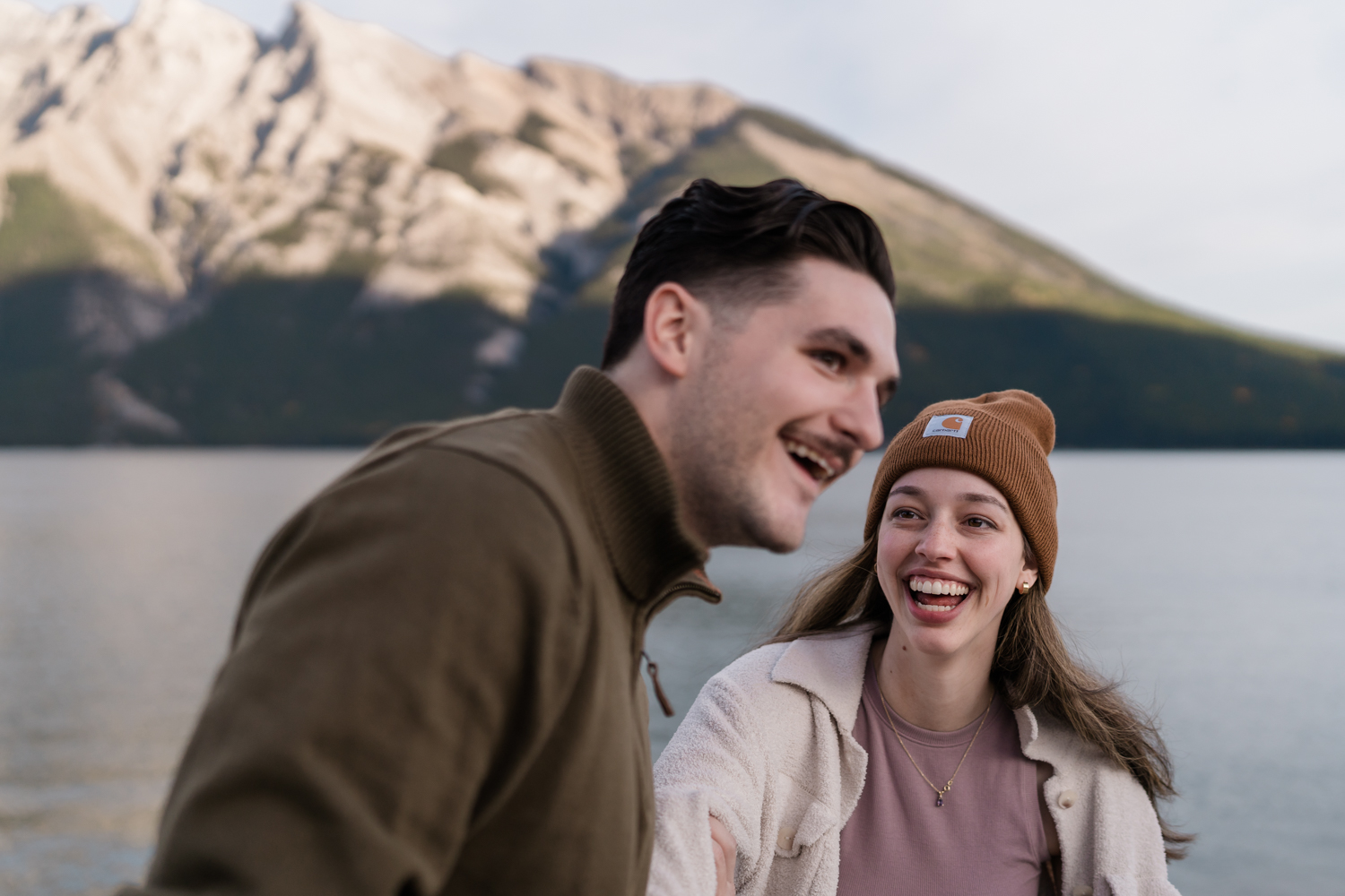 Couple laughs together after Banff proposal. 
